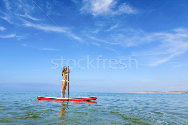 Woman practicing paddle Stock photo © iko