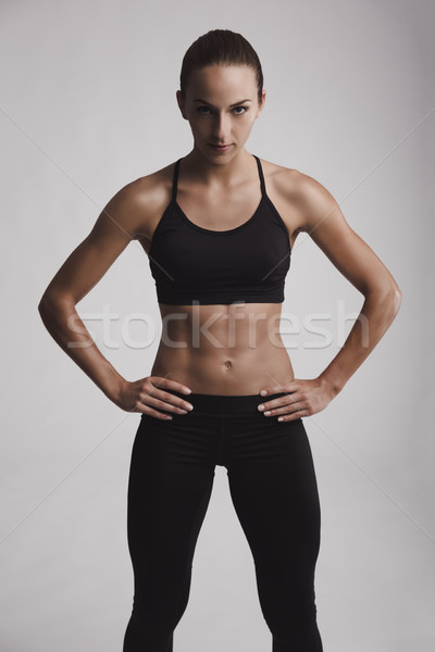 Femme de remise en forme portrait jeune femme corps musclé regarder [[stock_photo]] © iko