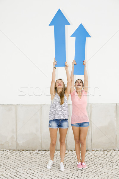 Teenagers pointing blue arrows Stock photo © iko