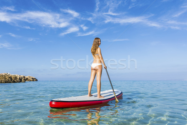 Woman practicing paddle Stock photo © iko