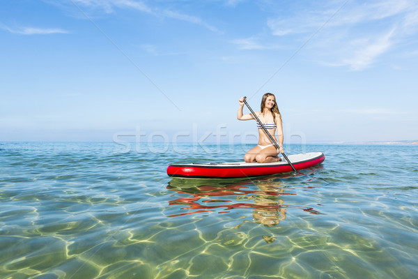 Woman practicing paddle Stock photo © iko