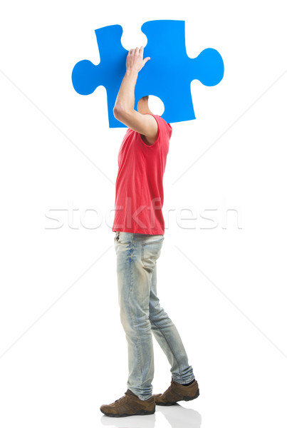 Młody człowiek puzzle kawałek dobrze wygląda niebieski Zdjęcia stock © iko