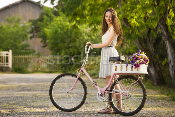 快樂的女孩 自行車 美麗 年輕女子 充分 野花 商業照片 © iko