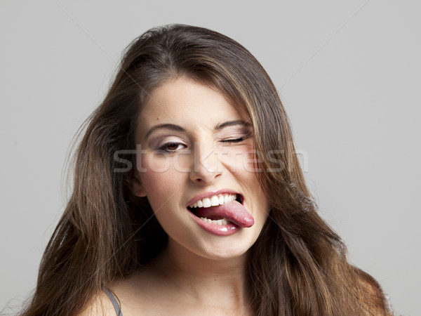 Girl with tongue out Stock photo © iko