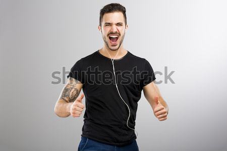 Happy man listen music Stock photo © iko