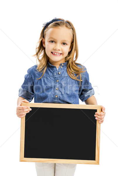 Girl holding a chalkboard Stock photo © iko