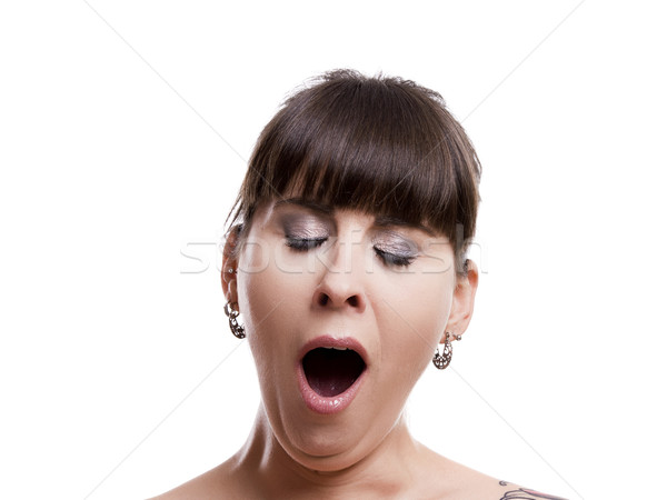 Close-up portrait of a sleepy woman yawn, isolated on white background Stock photo © iko