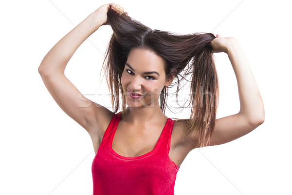 Woman grabbing her hair Stock photo © iko