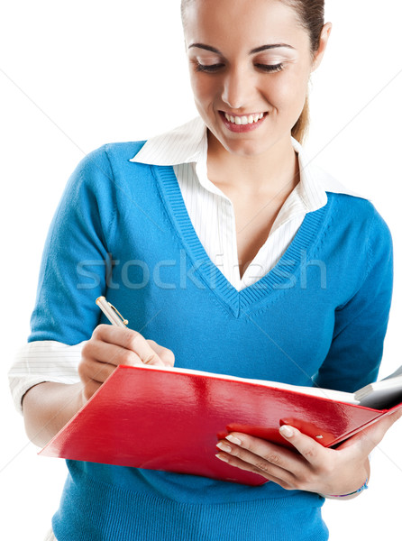 Belo feminino estudante escrita algo isolado Foto stock © iko
