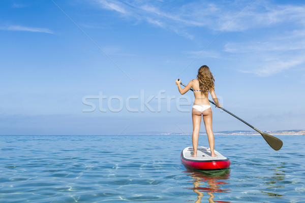 Woman practicing paddle Stock photo © iko