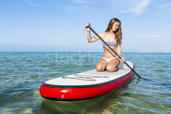 Woman practicing paddle Stock photo © iko