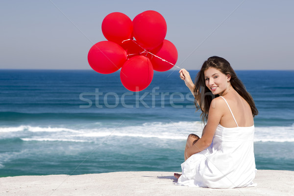 Fille rouge belle fille séance plage femme [[stock_photo]] © iko