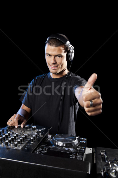 Portrait of a happy DJ with thumbs up Stock photo © iko