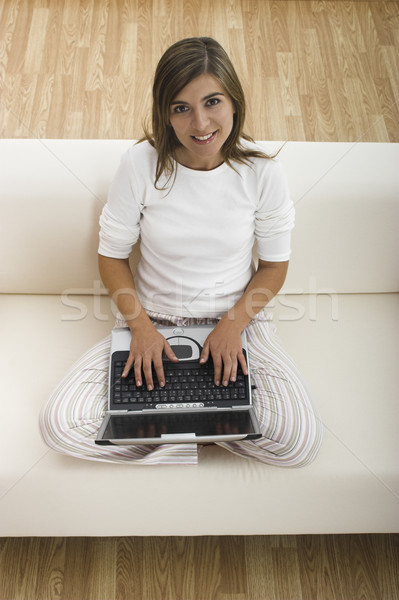Házi feladat laptop boldog gyönyörű nő dolgozik otthon Stock fotó © iko