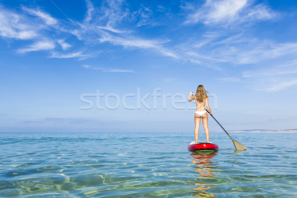 Woman practicing paddle Stock photo © iko