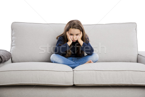 Bouleversé petite fille séance canapé quelque chose enfants Photo stock © iko