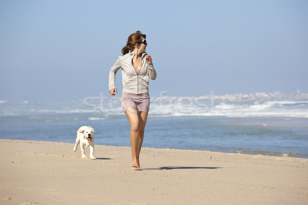 Fille cute chien jeune femme courir jouer [[stock_photo]] © iko
