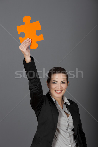 Solution femme d'affaires grand puzzle pièce [[stock_photo]] © iko