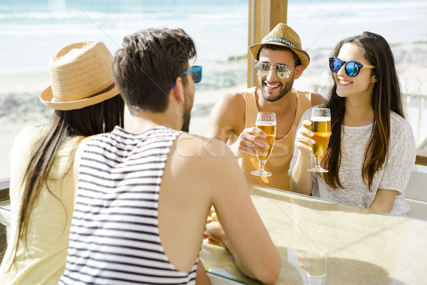 Friends at the beach bar Stock photo © iko