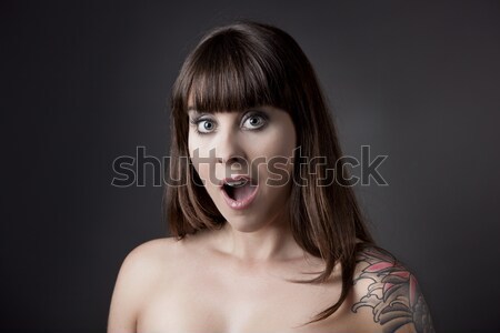 Stock photo: Astonished woman