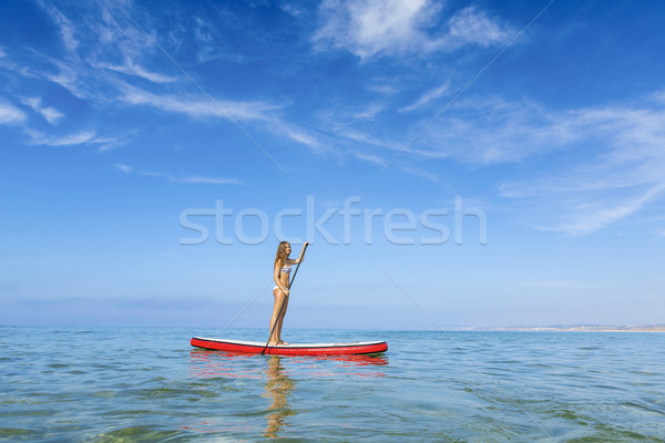 Woman practicing paddle Stock photo © iko