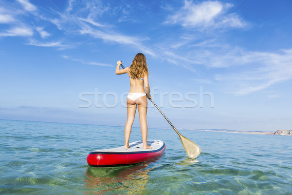 Woman practicing paddle Stock photo © iko