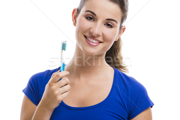 Foto stock: Bela · mulher · escova · de · dentes · sorrir · isolado