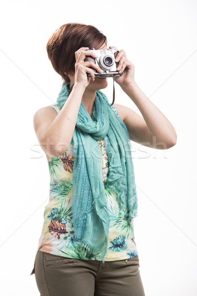 Woman taking a photo with a vintage camera Stock photo © iko