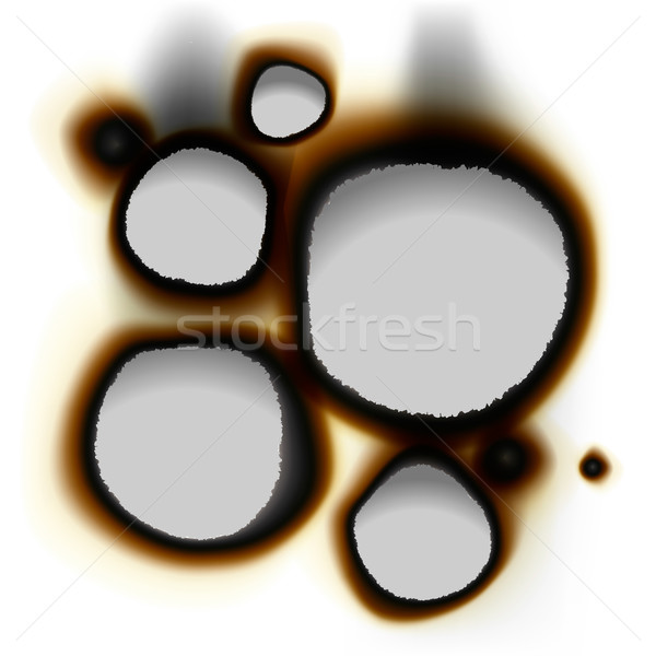 Collection of burnt holes in white paper Stock photo © ikopylov