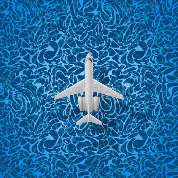 Airplane flies over a sea Stock photo © ikopylov