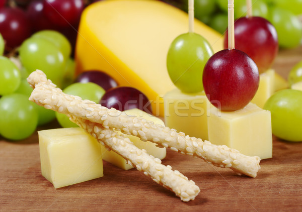 Gergelim vara queijo uvas vermelho branco Foto stock © ildi