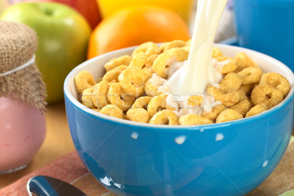 Pouring Milk Over Honey Flavored Cereal Loops Stock photo © ildi