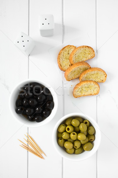 Black and Green Olives with Crostini Stock photo © ildi