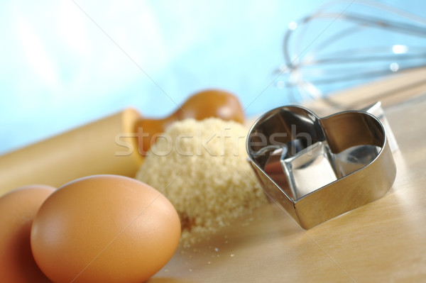 Heart Shaped Cookie Cutter with Baking Ingredients Stock photo © ildi