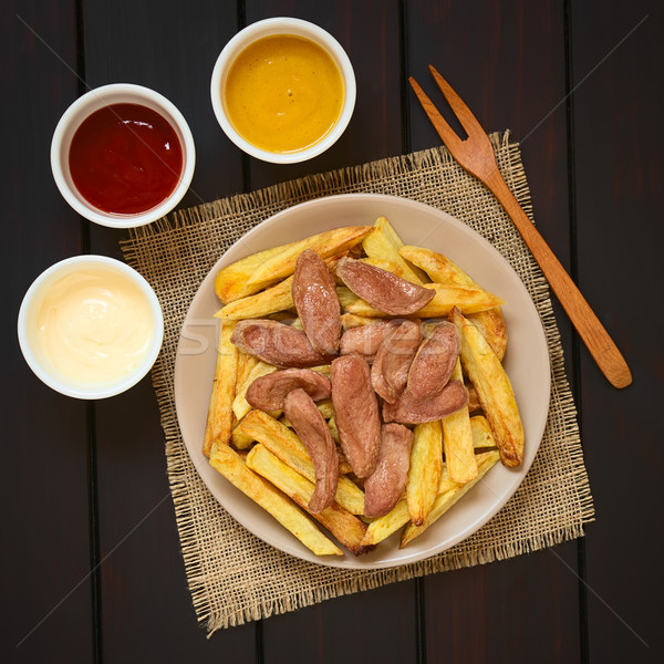 Salchipapas (Fries with Sausage) South American Fast Food Stock photo © ildi