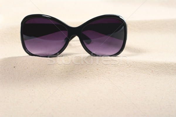 Sunglasses on Sand Stock photo © ildi