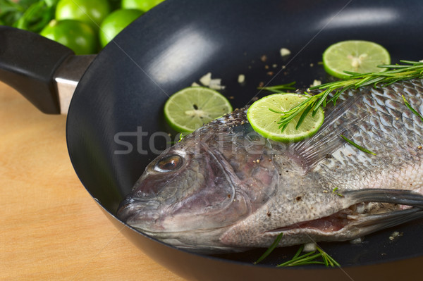 Raw Tilapia with Condiments in Frying Pan Stock photo © ildi