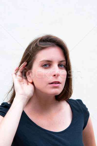 Stock photo: Relying on hand-ear listening woman 