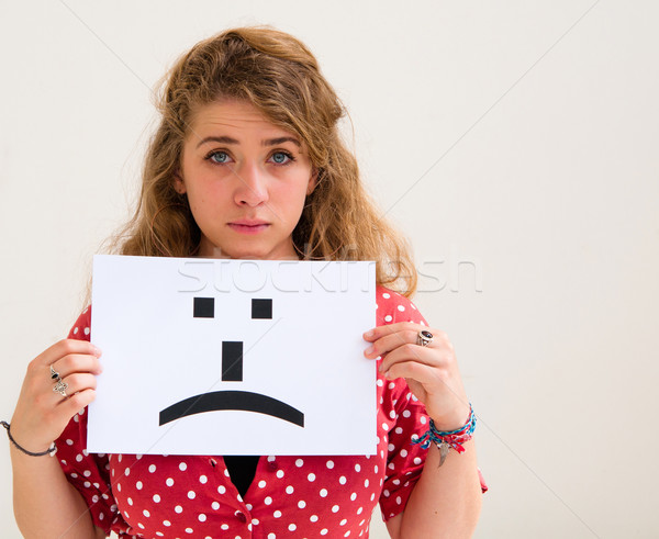 portrait young woman with board sad emoticon face sign  Stock photo © ilolab