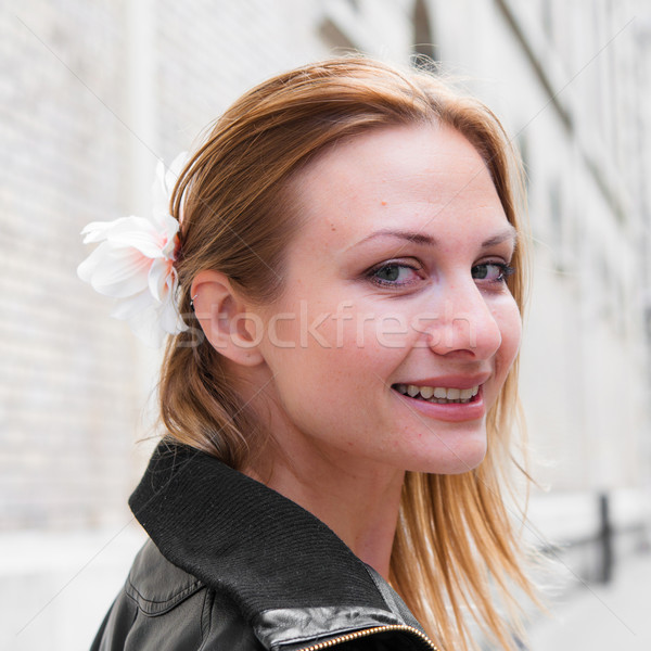 beautiful attractive young woman smiling while looking back  Stock photo © ilolab