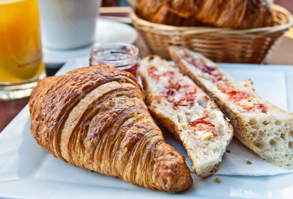Breakfast with coffee and croissants in a basket on table Stock photo © ilolab