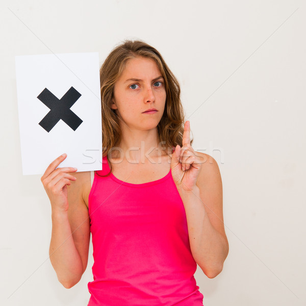 unhappy portrait young woman with board NO  Stock photo © ilolab