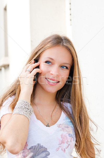 Portrait of a smiling young businessman giving call me gesture o Stock photo © ilolab