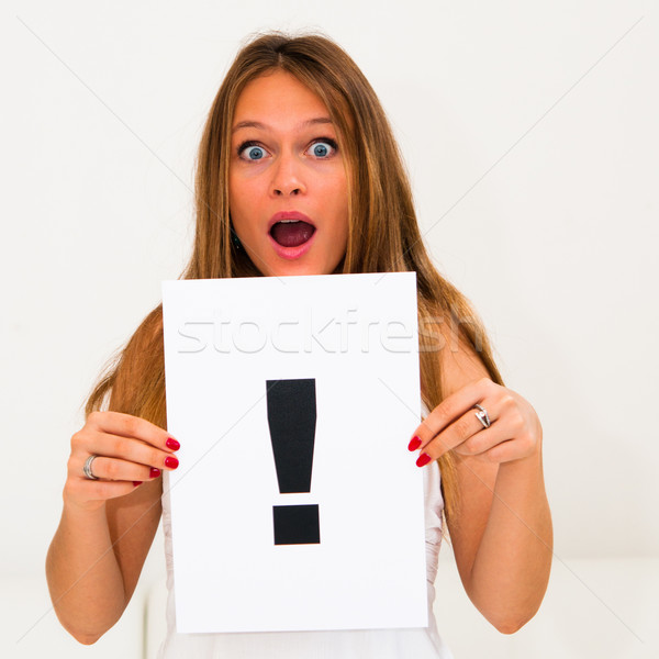 portrait young woman with board exclamation point  Stock photo © ilolab