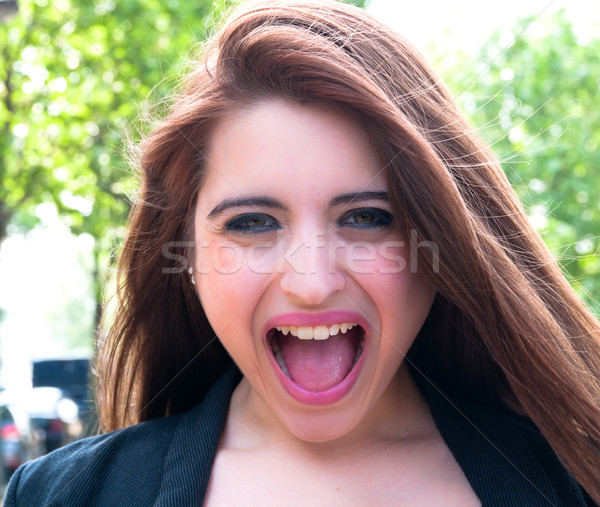 Young woman screaming with crazy expression Stock photo © ilolab