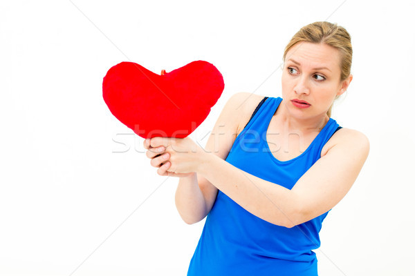 sad woman holding red valentine heart Stock photo © ilolab