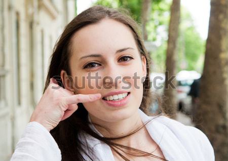 Portrait of a smiling young businessman giving call me gesture Stock photo © ilolab