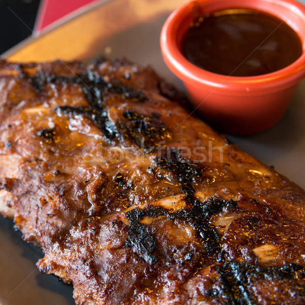 Gegrillt Steak gegrilltes Fleisch Rippen Platte hot sauce Stock foto © ilolab