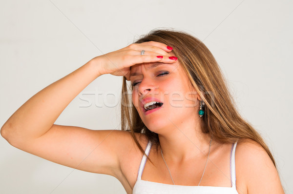 young woman with headache holding her hand to the head  Stock photo © ilolab