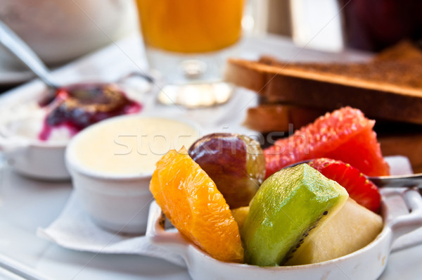 Breakfast with orange juice and fresh fruits on table Stock photo © ilolab